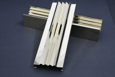 Two louver sections crossed, gold and stainless steel — Decorative Louvers · Metal Louvers