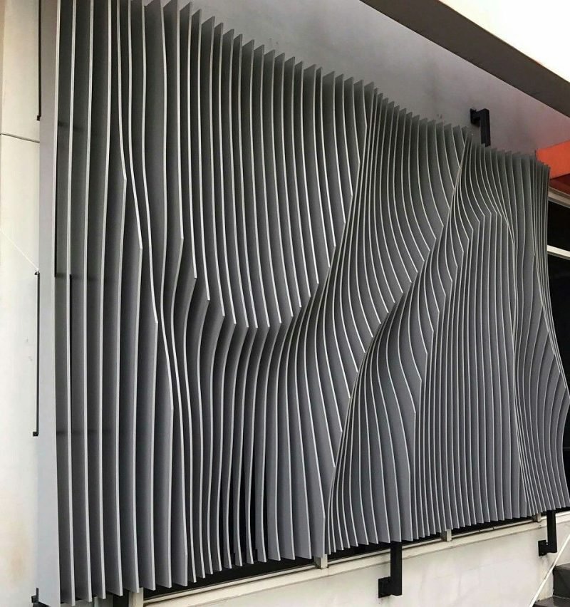 A parametric fin wall installed, each fin cut to its own curve