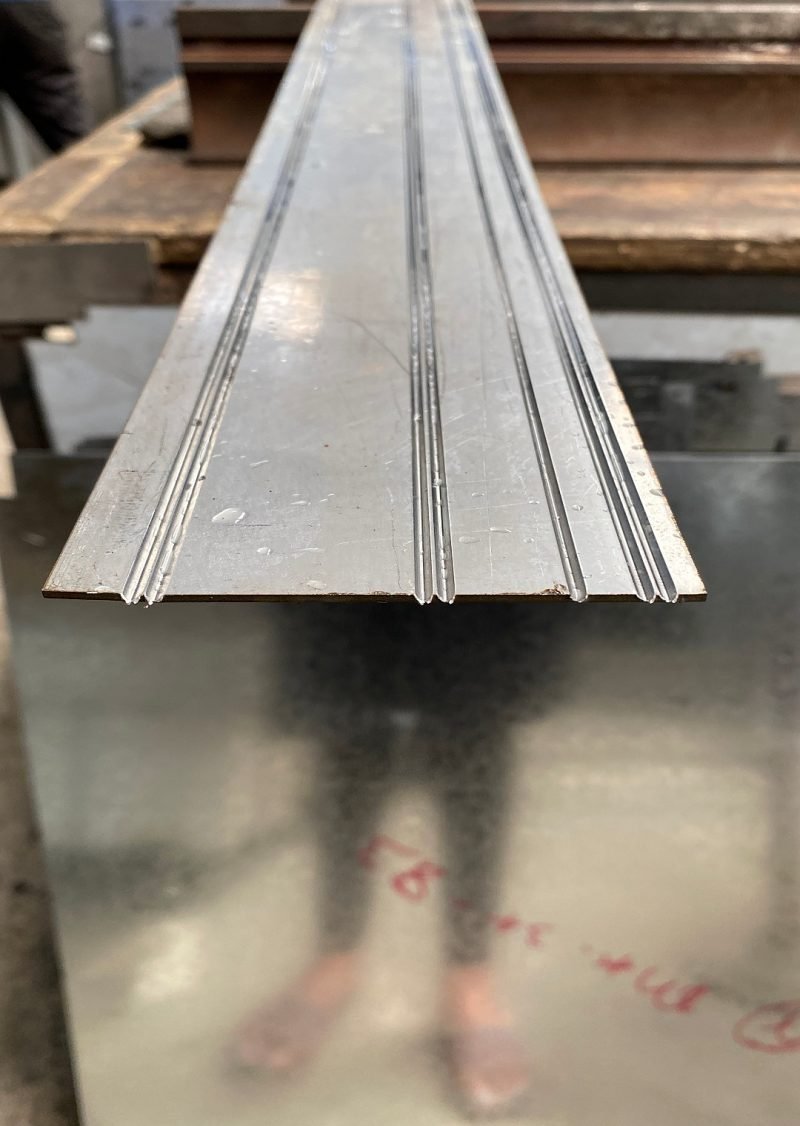 A V-grooved flat blank before folding