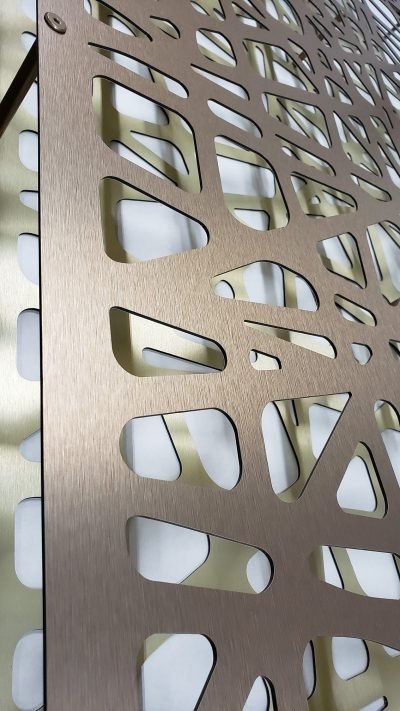 A laser-cut screen in bronze finish